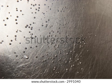 Metallic surface with small bubbles.