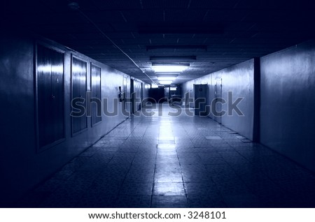 Dark corridor in office building. Blue tint.