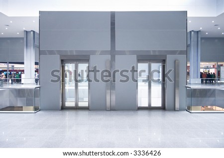 Lift doors on a top storey in a business center.