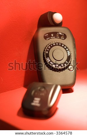 Flashmeter on exhibition. Red background.