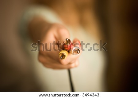 Woman hand with plugs. Low DOF.