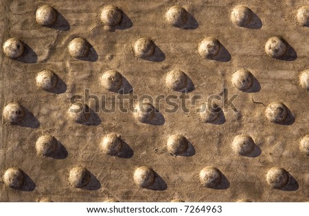 Stone background with sphere pattern and contrast shadows.