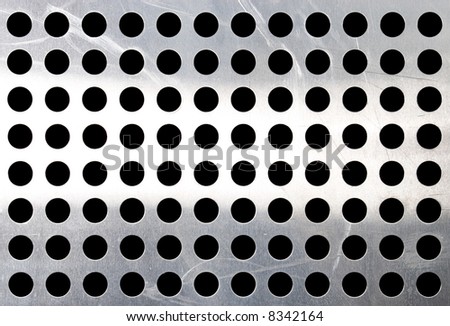 Metallic surface with holes. Texture or background.