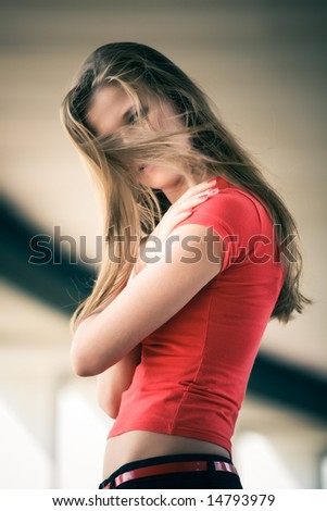 Woman with fluttering hairs. Concept outdoors portrait.