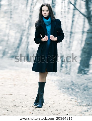 Lonely woman in a forest. Infra red colors.