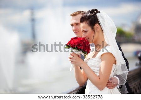 Young couple wedding. Looking to the river.