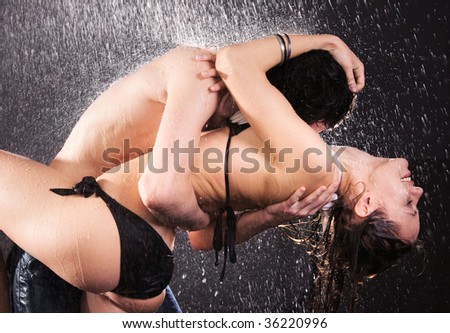 couple kissing in rain. Young couple kissing.
