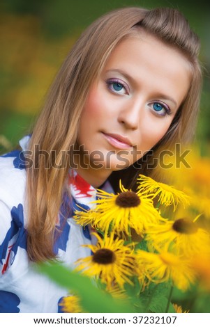 Young woman with flowers portrait.