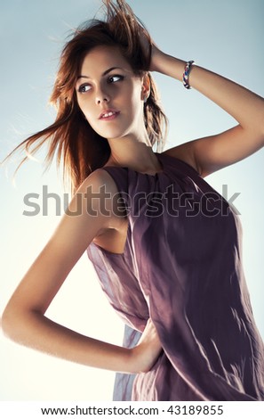 Young slim woman with fluttering hair portrait.