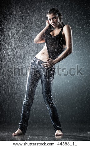 Young sexy woman water studio photo. Contrast colors.