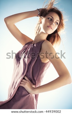 Young slim woman with fluttering hair portrait.