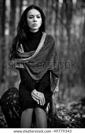 Young woman in forest. Black and white concept.