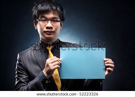 Young japan businessman with blank page. Contrast colors.