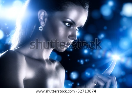 Young woman studio fashion portrait with blue stars.
