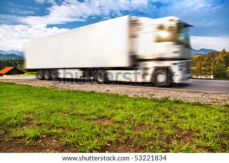 Truck transportation. Wide angle view and blurred motion effect.