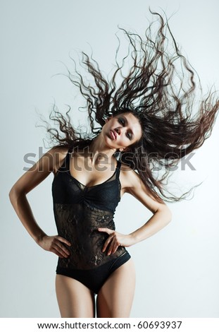 Young sexy woman with fluttering hair.