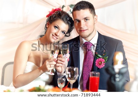 Young wedding couple on party.
