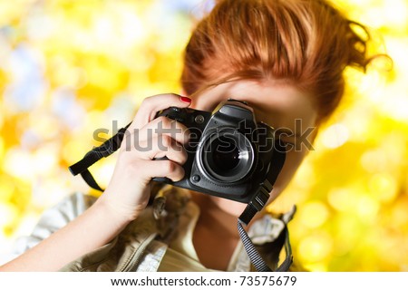 Young woman photographer outdoors portrait.