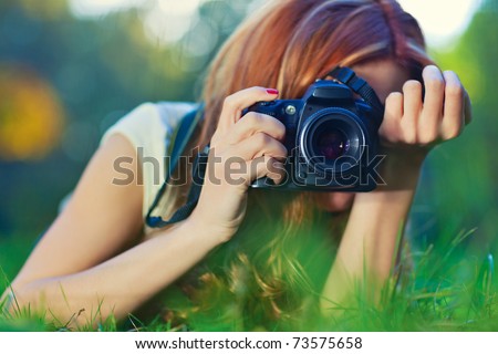 Young woman photographer portrait. Soft colors.