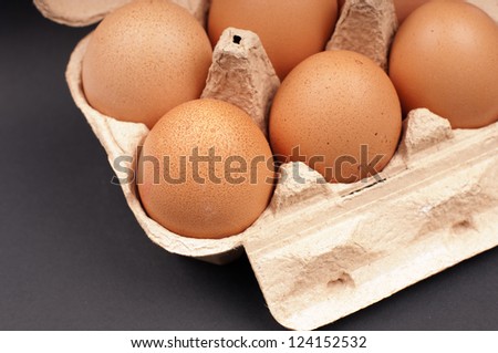 Eggs in an Egg Carton on a black background