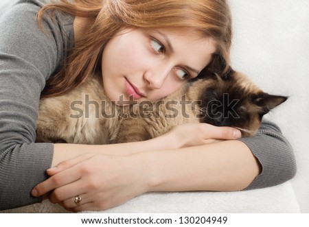 cute girl affectionately hugging  kitten
