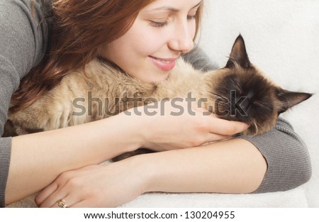 cute girl affectionately hugging  kitten