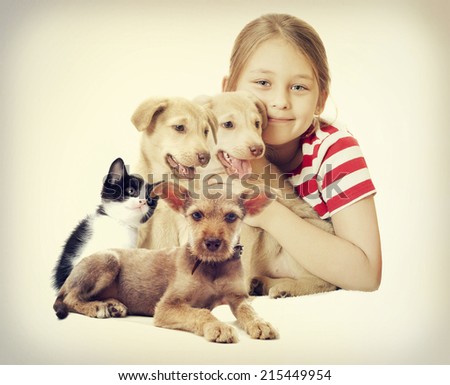 child and a group of pets