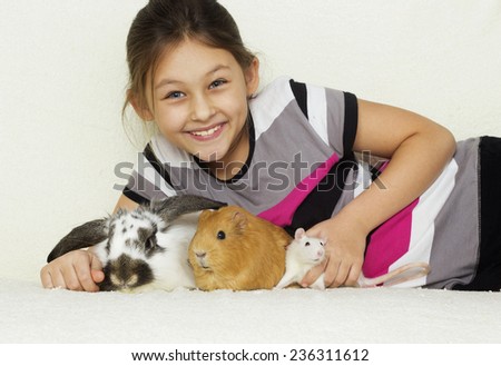 child and a set of rodents, guinea pig, rabbit, rat