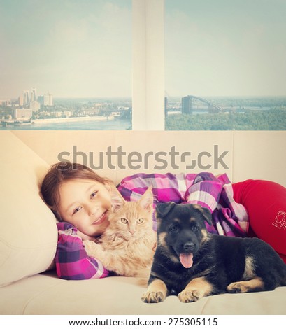 Child and puppy and kitten