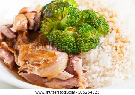 turkey meat topped with steamed broccoli and gravy on a side