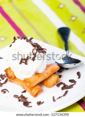 fried custard wrapped lumpia wrapper topped with vanilla ice cream and shaved truffle chocolates