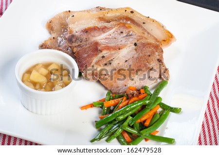 pork steak with apple sauce and french beans