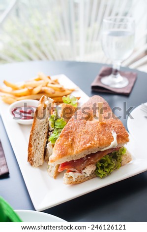 chicken club house sandwich with french fries