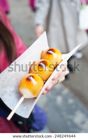 dango, grilled japanese rice balls in sweet soy sauce, famous japanese street food