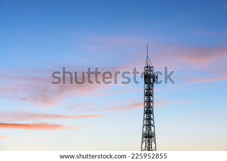 Silhouette of high communication antenna in sunset time in morning and evening time