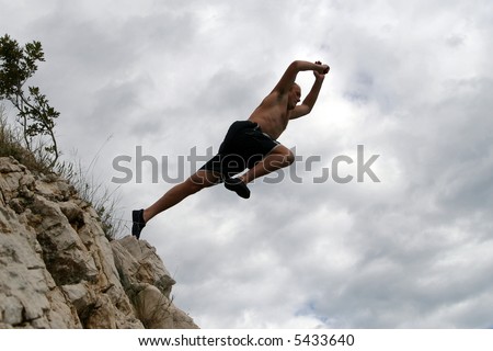 Dare To Take Off A young man jumps from a cliff into the sea!