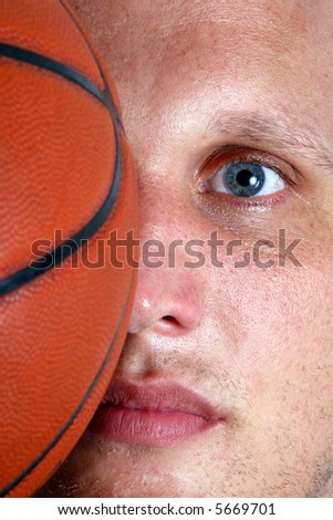 Basketball On My Mind A closeup of a basketball player with half of his face covered with a ball!