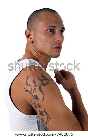 stock photo Muscular Male Young man showing his muscles and his tattoo 