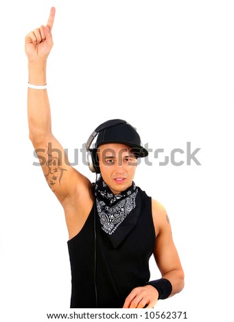 stock photo A young DJ with headphones in black with tattoo raising his 