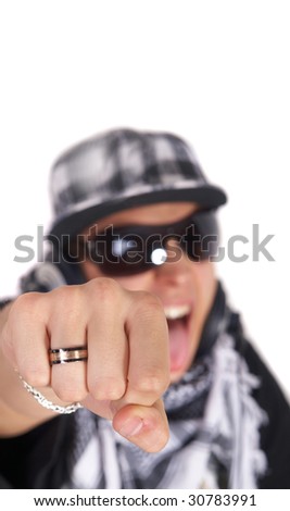 A young DJ is pointing at the camera and screaming. The focus is on his fist! Isolated over white.