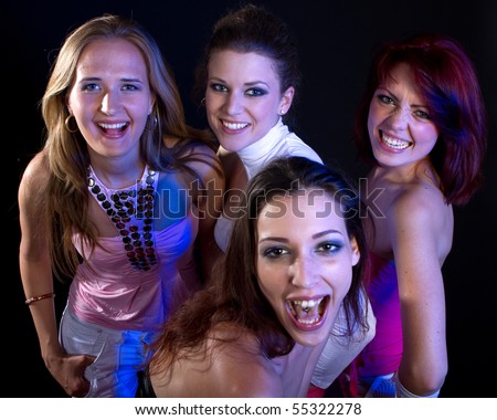 A group of four young fresh women partying. Nice lively image.