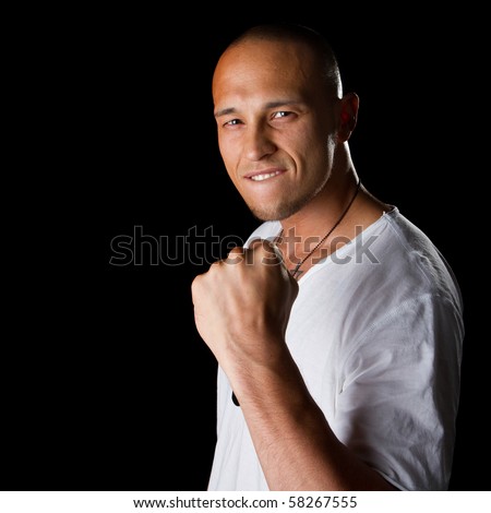 stock photo Young male filipino model over a black background is gesturing