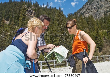 Family with senior parents hiking in the alps in Austria.