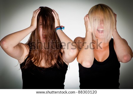 Two young women with hair over their head