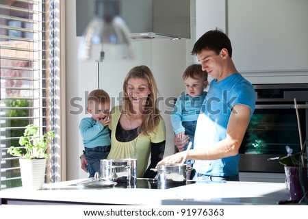 Young family cooking in a modern kitchen setting