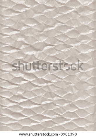 Crumpled paper. A porous paper. The thin structure fine chaotic fibers is visible