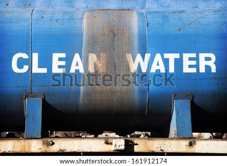 MOYALE, KENYA - NOVEMBER 11, 2012 - A rusty water-tank with the description \'clean water\'.