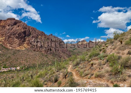 AZ-Western Superstition Mountain Wilderness. Dutchman\'s Trail This area is located outside Apache Junction and Gold Canyon. It is a spectacular mountain and desert environment.