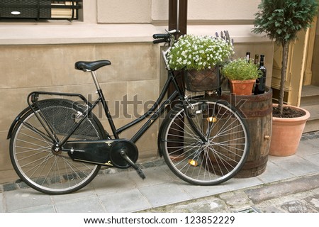retro wega bike stands on the street near the wall