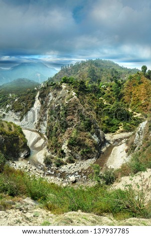 Sharp bend of the river bed flowing into a deep canyon. Himalayas, Uttarakhand, Gochar